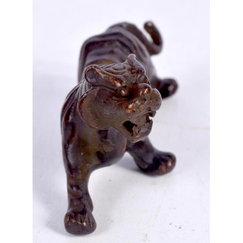 1439 - A BRONZE MODEL OF A TIGER.  7.7cm x 4cm x 3cm, weight 93.5g