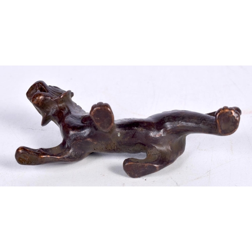 1439 - A BRONZE MODEL OF A TIGER.  7.7cm x 4cm x 3cm, weight 93.5g