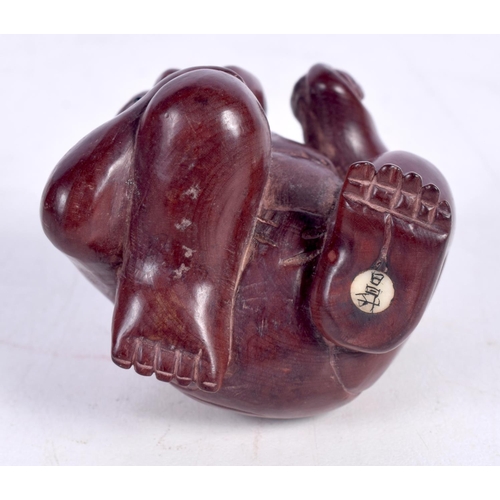 1444 - A JAPANESE CARVED HARDWOOD FIGURE OF A CROUCHING MALE.  5.3cm x 4.5cm x 5.1cm, weight 37.3g