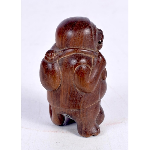 1445 - A JAPANESE CARVED HARDWOOD FIGURE OF A HOODED MONKEY WITH A SACK ON HIS BACK.  5.3cm x 3.2 cm x 3.2 ... 