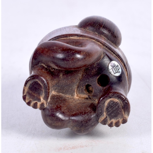 1445 - A JAPANESE CARVED HARDWOOD FIGURE OF A HOODED MONKEY WITH A SACK ON HIS BACK.  5.3cm x 3.2 cm x 3.2 ... 