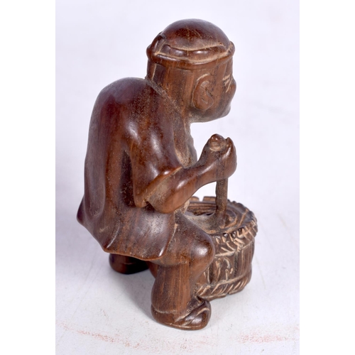 1446 - A JAPANESE CARVED HARDWOOD FIGURE OF A SAGE.  5.4cm x 3.7cm x 3.7cm, weight 44.1g