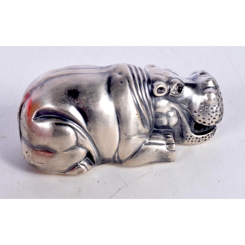 1455 - A CONTINENTAL SILVER MODEL OF A HIPPO WITH RED GEM SET EYES.  Stamped 88, 7.9cm x 3.4cm x 3.7cm, wei... 