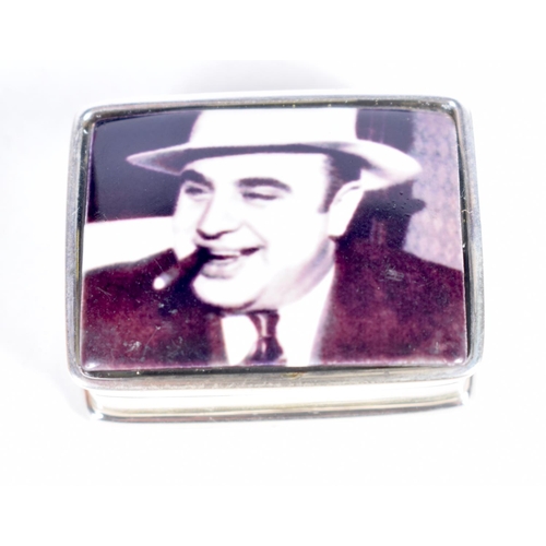 1458 - A SILVER PILL BOX WITH TOP DECORATION OF AL CAPONE.  Stamped Sterling, 2.6 cm x 1.3cm x 3.2 cm, weig... 