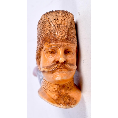 1475 - A MEERSCHAUM PIPE CARVED WITH THE HEAD OF A COSSACK WITH AN AMBER STEM WITH A CONTINENTAL SILVER COL... 