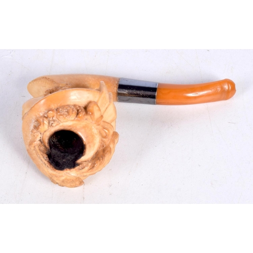 1482 - A MEERSCHAUM PIPE WITH THE BOWL CARVED AS A VICTORIAN LADY IN A FEATHERED HAT WITH AN AMBER MOUTHPIE... 