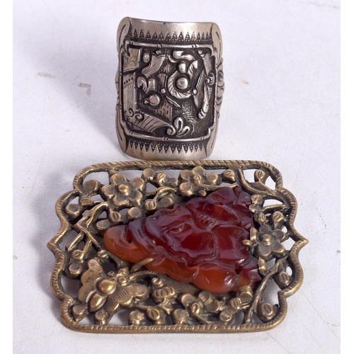 1505 - A CHINESE YELLOW PIERCED METAL AND AMBER BROOCH TOGETHER WITH A WHITE METAL RING.  Brooch 3.5cm x 4.... 