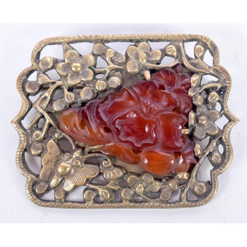 1505 - A CHINESE YELLOW PIERCED METAL AND AMBER BROOCH TOGETHER WITH A WHITE METAL RING.  Brooch 3.5cm x 4.... 