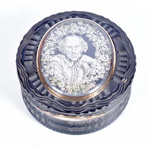 1506 - A GEORGIAN LACQUER SNUFF BOX WITH A REVERSE PAINTED TOP AND GILT MOUNTS.  7.1cm diameted x 3.8 cm