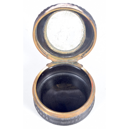 1506 - A GEORGIAN LACQUER SNUFF BOX WITH A REVERSE PAINTED TOP AND GILT MOUNTS.  7.1cm diameted x 3.8 cm