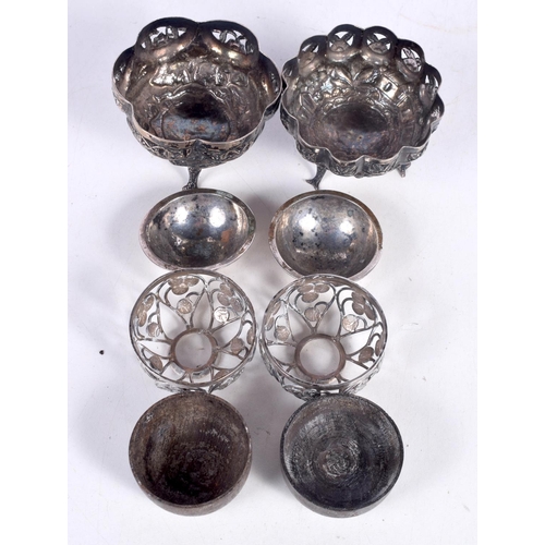 1510 - TWO WHITE METAL EMBOSSED BON BON DISHES ON THREE MERMAID TAIL FEET TOGETHER WITH TWO PIERCED WHITE M... 