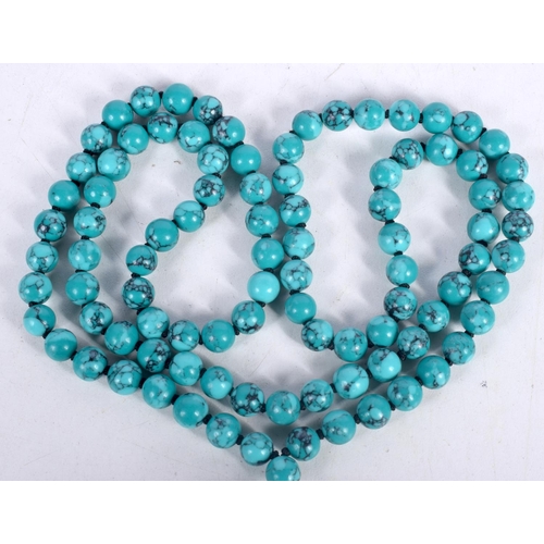 1518 - A TURQUOISE BEAD PENDANT NECKLACE.  84cm long, bead size 7.9mm, Pendant 4.1cm long, weight 105g