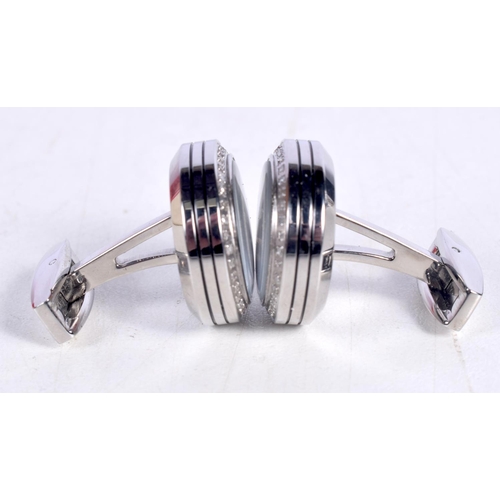 1525 - A CASED PAIR OF JEAN PIERRE TOURBILLON STEEL PLATED CUFFLINKS.  A stunning pair of modern cufflinks,... 