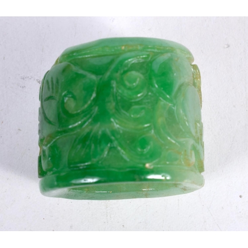 1542 - A CARVED GREEN JADE ARCHER'S RING.  3.3cm x 2.8 cm, weight 34g