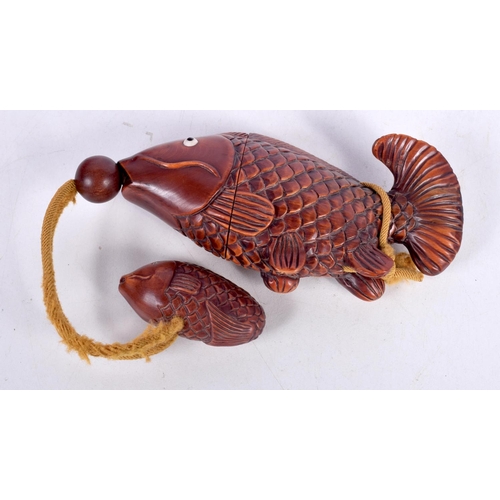 1544 - A JAPANESE CARVED HARDWOOD INRO CARVED IN THE FORM OF A FISH.  12.7cm x 3.1cm x 5.3cm, weight 71g