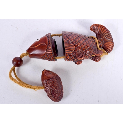 1544 - A JAPANESE CARVED HARDWOOD INRO CARVED IN THE FORM OF A FISH.  12.7cm x 3.1cm x 5.3cm, weight 71g