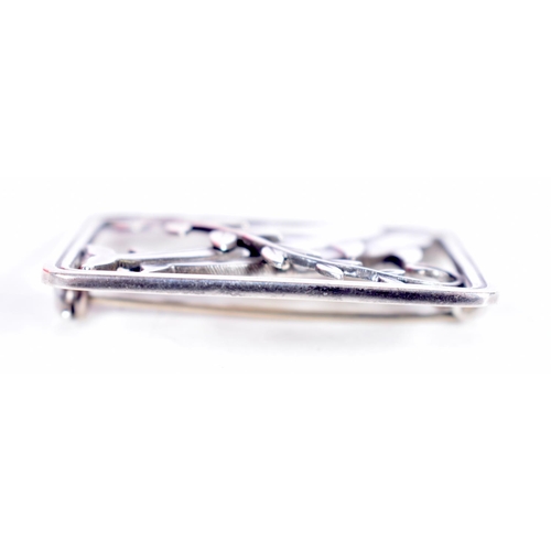 1554 - A GEORG JENSEN SILVER DOLPHIN BROOCH. 18 grams. 3.5 cm x 3 cm.