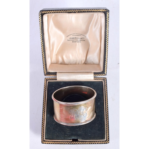 1555 - A CASED SILVER NAPKIN RING together with an early Elkington miniature candlestick, a knife & a horn ... 