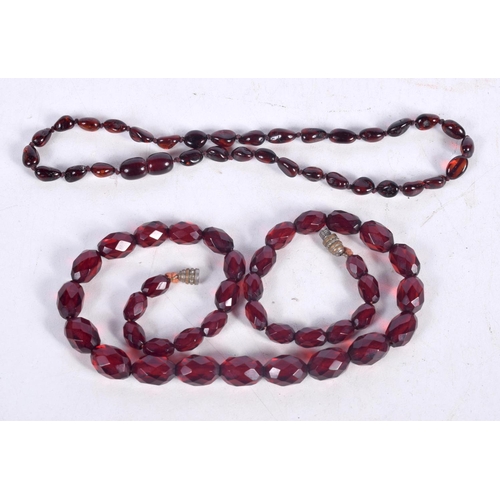 1584 - A CHERRY AMBER TYPE FACETED NECKLACE. 21 grams. 42 cm long.