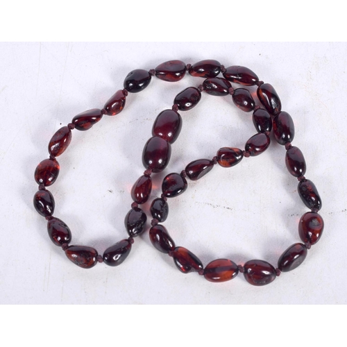 1584 - A CHERRY AMBER TYPE FACETED NECKLACE. 21 grams. 42 cm long.