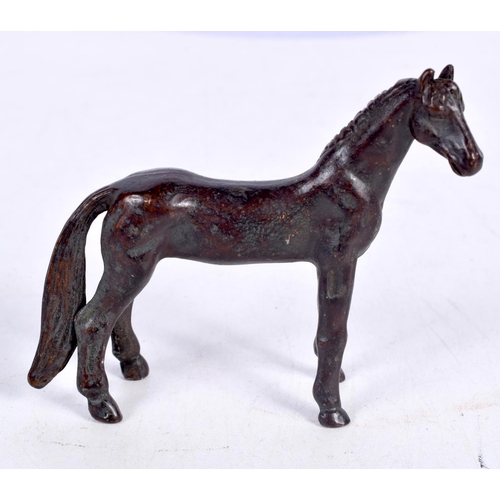 1621 - A JAPANESE BRONZE HORSE OKIMONO. 128 grams. 7cm x 7cm.