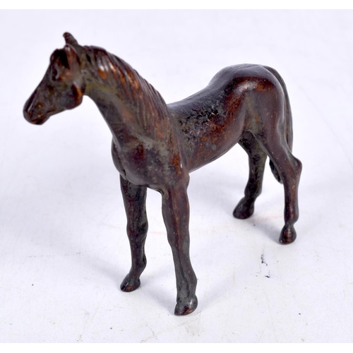 1621 - A JAPANESE BRONZE HORSE OKIMONO. 128 grams. 7cm x 7cm.