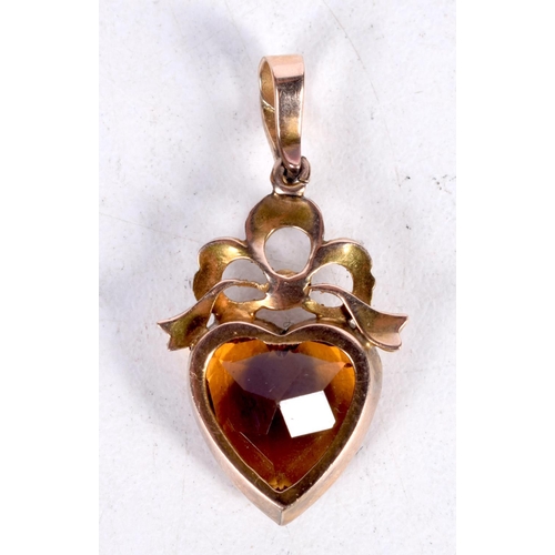 1632 - AN ANTIQUE YELLOW METAL PEARL HEART FORM PENDANT. 3.2 grams. 3.25 cm x 1.75 cm.