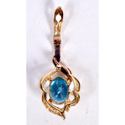 1642 - A YELLOW METAL BLUE STONE PENDANT. 3.7 grams. 3 cm x 1.5 cm.