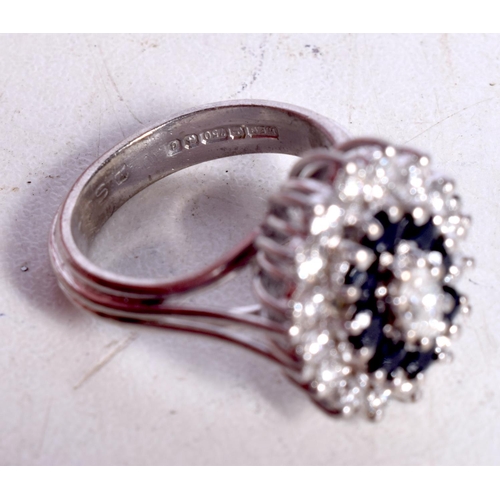 1644 - AN 18CT GOLD DIAMOND AND SAPPHIRE RING. 9.3 grams. M.