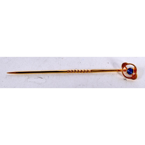 1650 - A LATE VICTORIAN 15CT GOLD AND SAPPHIRE TIE PIN. 1.1 grams. 6 cm long.