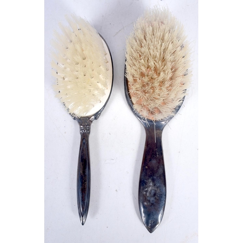 1683 - A PAIR OF SILVER BACKED BRUSHES. 88 grams overall. 15.5 cm x 4.5 cm.