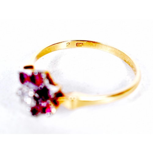 1686 - AN 18CT GOLD DIAMOND AND RUBY RING. 2.3 grams. N.