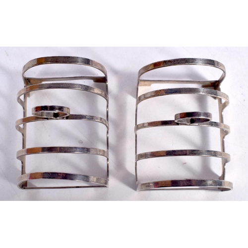 1696 - A PAIR OF ART DECO SILVER TOAST RACKS. Birmingham 1935. 85 grams. 7.5 cm x 6.75 cm.