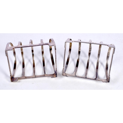 1696 - A PAIR OF ART DECO SILVER TOAST RACKS. Birmingham 1935. 85 grams. 7.5 cm x 6.75 cm.