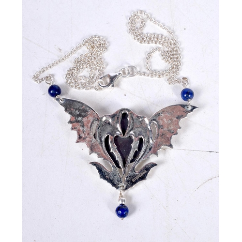 1721 - A SILVER AND LAPIS LAZULI NECKLACE. 14 grams. 46 cm long, pendant 5 cm x 4 cm.