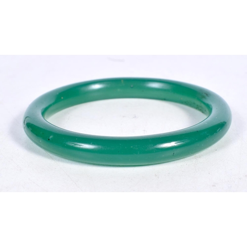 1748 - A CHINESE JADE BANGLE. 29.5 grams. 5.5 cm wide.