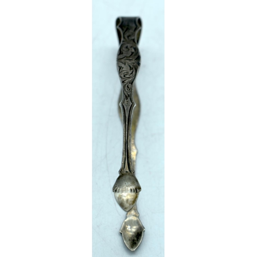 1762 - A PAIR OF GEORGE III SILVER SUGAR TONGS. London 1801. 28.2 grams. 14cm long.