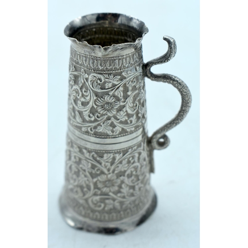 1767 - AN INDIAN WHITE METAL JUG. 72 grams. 10 cm high.