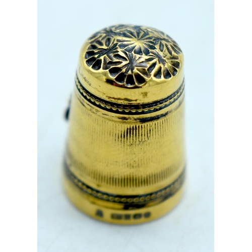 1771 - A VICTORIAN YELLOW METAL CARRIAGE THIMBLE. 6 grams. 2 cm high.