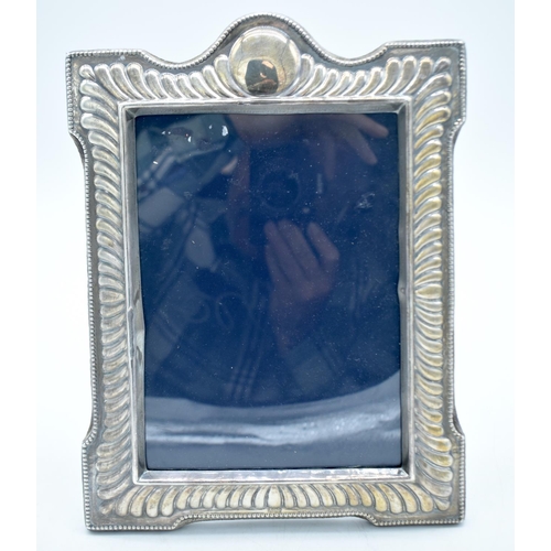 1772 - A SILVER PHOTOGRAPH FRAME. Sheffield 1988. 763 grams overall. 30cm x 22cm.