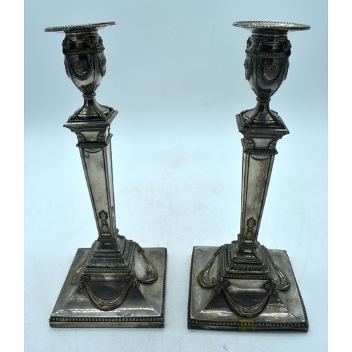 1774 - A PAIR OF GEORGE III OLD SHEFFIELD PLATED CANDLESTICKS. 1532 grams overall. 31 cm x 12.5 cm.