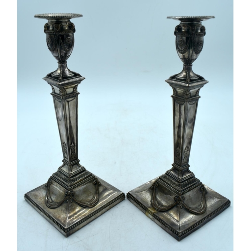 1774 - A PAIR OF GEORGE III OLD SHEFFIELD PLATED CANDLESTICKS. 1532 grams overall. 31 cm x 12.5 cm.