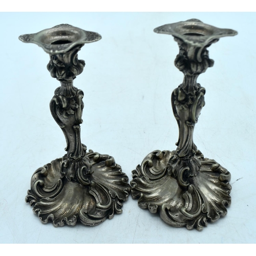 1775 - A SMALL PAIR OF ANTIQUE CONTINENTAL SILVER PLATED CANDLESTICKS. 421 grams. 11.5 cm high.