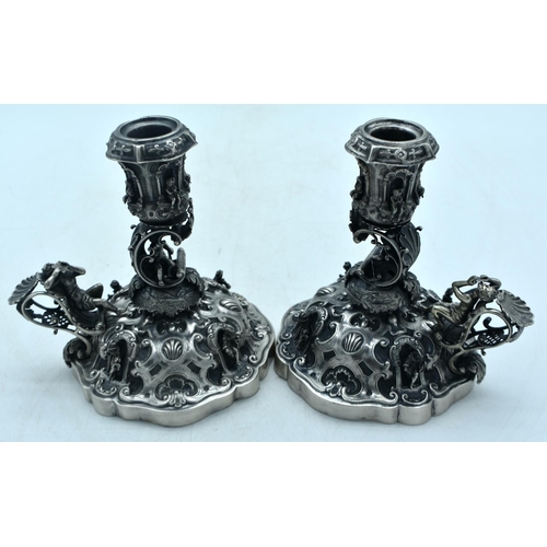 1776 - A FINE PAIR OF 19TH CENTURY CONTINENTAL SILVER SCALLOPED CANDLESTICKS. 749 grams. 15cm x 15cm.