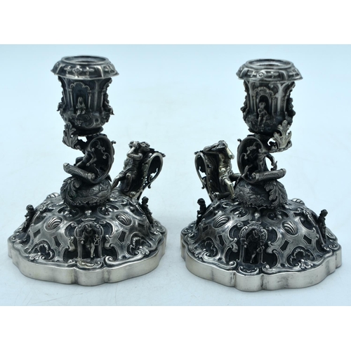 1776 - A FINE PAIR OF 19TH CENTURY CONTINENTAL SILVER SCALLOPED CANDLESTICKS. 749 grams. 15cm x 15cm.