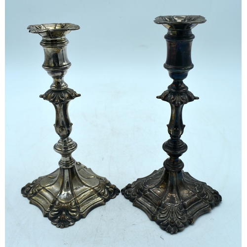 1777 - A PAIR OF GEORGE III OLD SHEFFIELD PLATED CANDLESTICKS. 1197 grams overall. 23 cm x 11.5 cm.