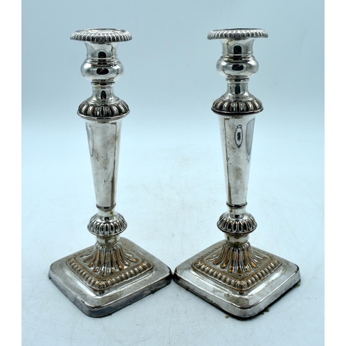 1780 - A PAIR OF ANTIQUE OLD SHEFFIELD PLATED CANDLESTICKS. 1902 grams overall. 28cm x 11cm.