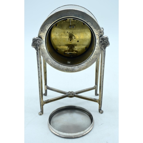 1783 - A LOVELY ART DECO SILVER AND ENAMEL MANTEL CLOCK with bold red enamel dial and rams head mounts. Bir... 