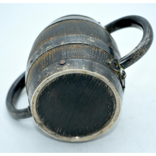 1804 - AN EDWARDIAN SILVER MOUNTED OAK CUP. 302 grams overall. 11.5 cm x 17.5 cm.