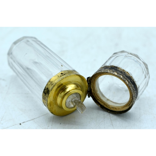 1836 - A CASED GLASS SCENT BOTTLE WITH YELLOW METAL MOUNTS.  Bottle 7.8 cm x 2.6 cm